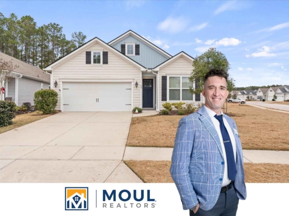 66 Slash Pine - Agent in front of property